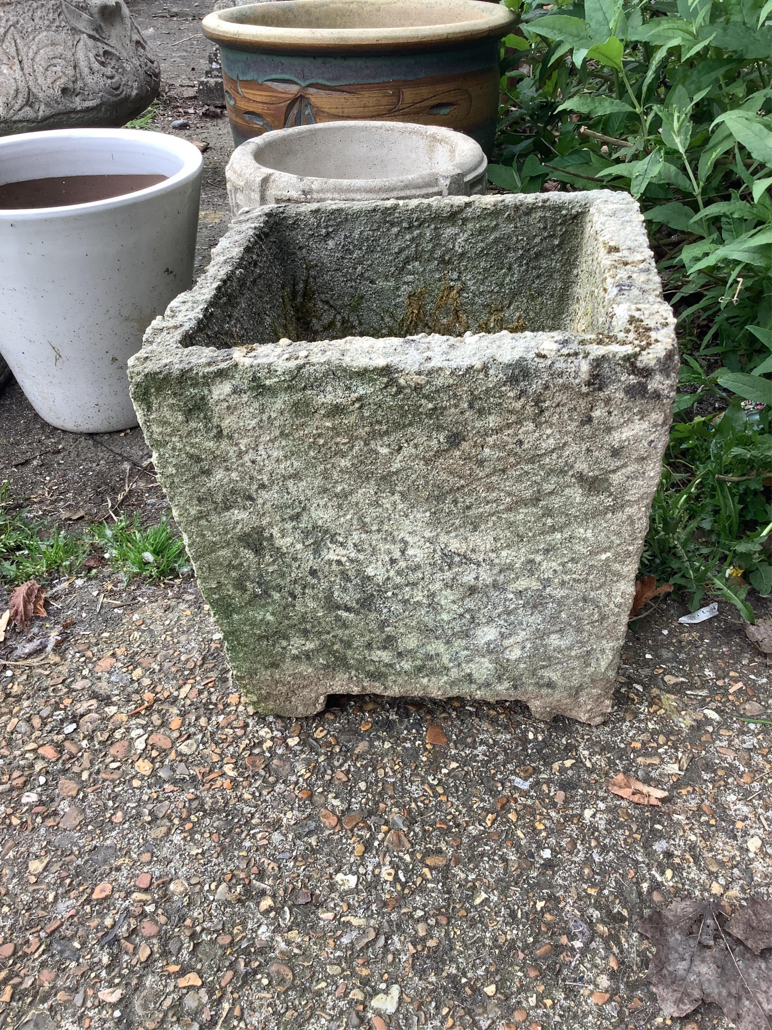 Six assorted stone and earthenware garden planters and a bird bath, largest diameter 38cm, height 32cm